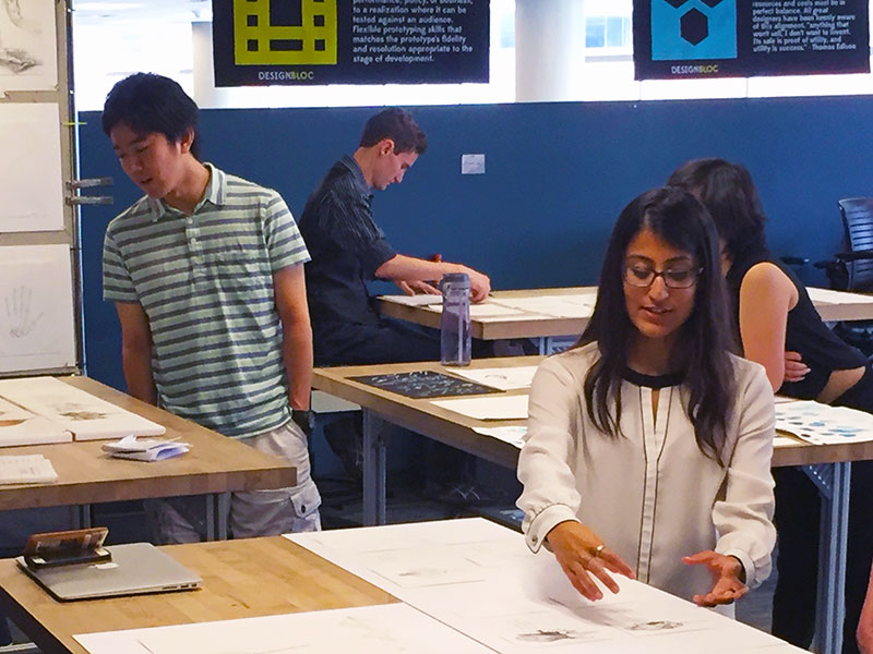 Students explore bio-inspired artwork during an open house for the Design Bloc course. 